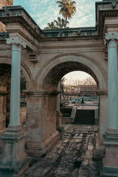 Hadrian's Gate in Antalya, Turkey — the ancient Roman triumphal arch at the entrance to Kaleiçi old town, minutes from the city's top dental clinics